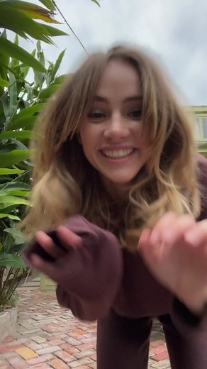 Outdoor Dance Performance in a Maroon Tracksuit