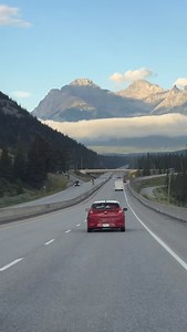 Johnston Canyon is a popular hike in Banff National Park, located along the Bow Valley Parkway, featuring waterfalls and catwalks built into the canyon walls. Visitors can hike to the easily accessible Lower Falls (about a 1-hour round trip) or continue to the Upper Falls (about a 2- 3 hour round trip). The trail is open year-round and is known for being very busy, so using Roam Transit is a good alternative to driving, especially in summer. Features paved sections and metal catwalks attached to