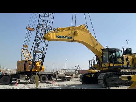 Komatsu PC 1250 hydraulic excavator assembling boom stick bucket and counter weight heavy equipment