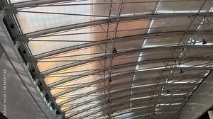 Skylight glass roof in a shopping mall. Bottom up view. Wide angle view