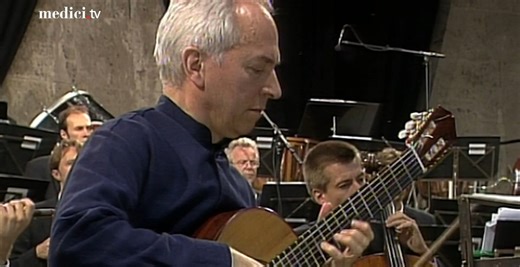 Rodrigo's Concierto de Aranjuez is one of the pinnacles of classical guitar music, inspired by the gardens at the Royal Palace of Aranjuez and evoking images of nature and courtly love. This rendition by virtuoso guitarist John Williams is as good as we've heard this masterpiece sound, recorded at the Waldbühne in 1998 with the Berliner Philharmoniker and Daniel Barenboim! https://bit.ly/40qtXiw | medici.tv