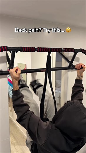 Dead hangs are a great place to begin when it comes to spinal decompression. By using gravity to gently stretch the body, they help reduce pressure on the spinal discs and relieve tension in the shoulders and upper back. However, because your grip and upper body are still doing much of the work, the amount of decompression you achieve can be limited. #spinaldecompression #lowerbackpain #backpain #spinehealth #unitedstates