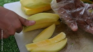Cut the mango using a knife on a cutting board