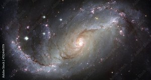 Zoom in on a spiral galaxy in the Dorado constellation. Colourful universe, cosmos, outer space with rotating galaxies, stars, planets against the dark void. Video based on images by NASA and ESA.