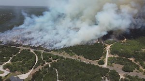 Sunlight hit glass bottles in a garbage can and ignited Possum Kingdom Lake fire, officials say