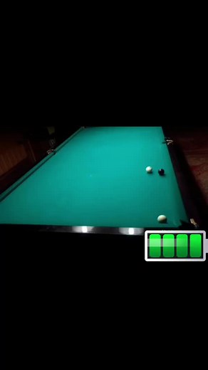 Exciting Pool Table Action: Cue Ball Strikes Black Ball