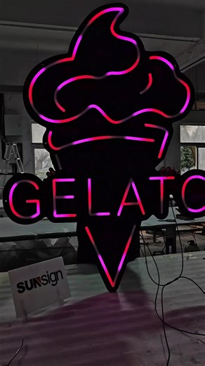 This custom shop neon sign is designed in a playful ice cream shape, creating a fun and eye-catching visual for retail spaces. It features chasing RGB LED lighting that produces dynamic color-changing effects, enhancing visibility and attracting attention both day and night. Crafted with high-quality LED neon flex, the sign delivers smooth illumination, vibrant colors, and energy-efficient performance, making it an ideal decorative and branding solution for ice cream shops, cafés, and dessert st