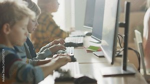Elementary School Computer Science Classroom: Smart Little Schoolchildren Work on Personal Computers, Learn Programming Language for Software Coding. Schoolchildren Getting Modern Education