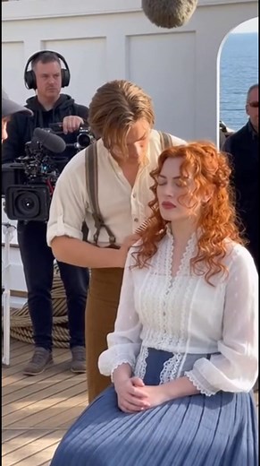 1.2M views · 9.5K reactions | Behind the Iconic Titanic Love Scene — Jack and Rose Between Takes ❤️ A rare behind-the-scenes moment from Titanic shows Jack gently fixing Rose’s hair before filming one of their romantic scenes on the ship’s deck. The crew stands around quietly as the magic between the actors comes alive even before the cameras roll. A beautiful look at how cinema’s most iconic love story was created. | Hollywood FrameLab | Facebook
