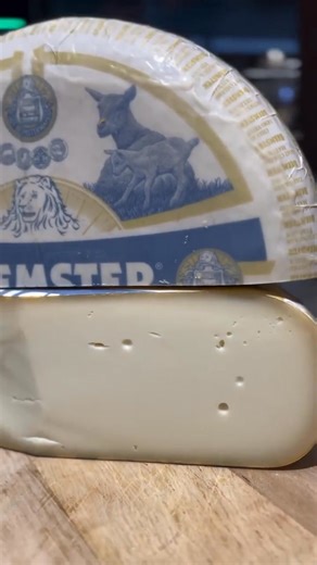 Indulge in the finer things, one slice at a time. 🐑🧀 "Beemster Goat Gouda! Distinguished by its delicate taste and creamy texture. This cheese is for those who appreciate balance and a refreshing, sweet, flavorful experience." -🎥: @cheesekingdomkhm #GoatCheese #CheeseLovers | Beemster