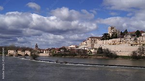 the Duero river in Zamora, Spain. You can see the medieval rolling dam and mill and the cathedral known as the Pearl of the Duero for its Byzantine dome and its great watchtower bell tower.