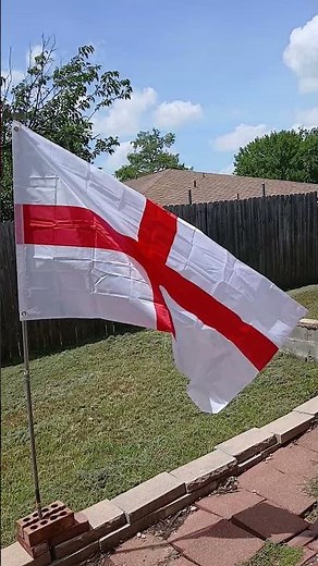 Big flag of England waving in the wind