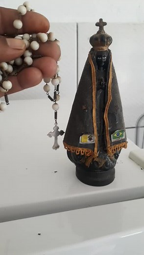 Exploring Symbolism in Beaded Cross and Figurines