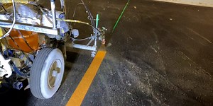 Parking lot lines are perfectly painted using specialized machines