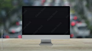 Bank flat icon on desktop modern computer monitor screen on wooden table over blur of rush hour with cars and road in city, Business banking online concept