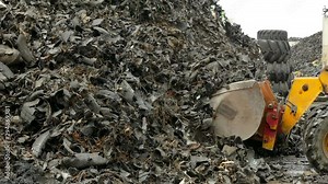 Recycling Tire Landfill / Excavation vehicle at the tire dump loading recyclable raw material