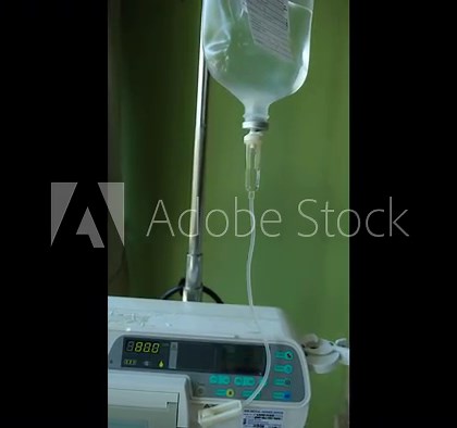 Saline bag drop solution is used in medical setups in hospital rooms.