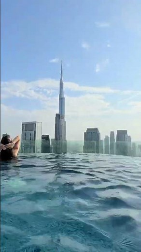 Immerse yourself in Dubai's skyline from the tranquility of Paramount Midtown Hotel's infinity pool.