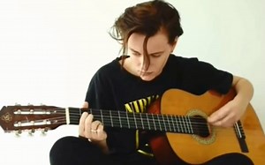 Erika Linder playing guitar