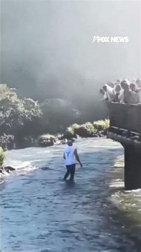 Tourist risks deadly fall... all for a cellphone