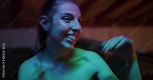 Friends Dancing and Celebrating at a Party with Flashing Lights