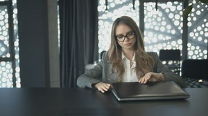 Female lawyer starts working with her laptop - Free Stock Video
