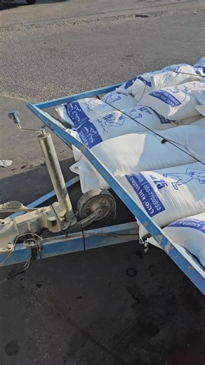 Showcasing Blue Trailer with Organized Sacks