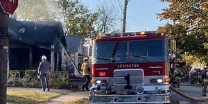 Crews battle fire at Lexington home