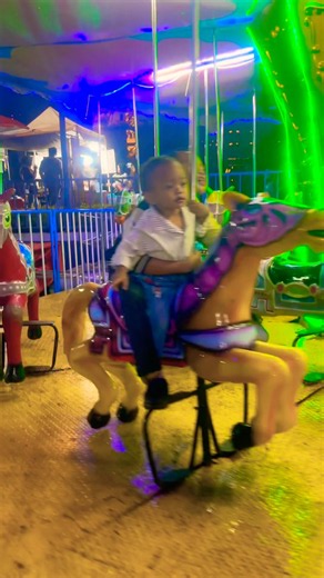 Cute yellow horse carousel