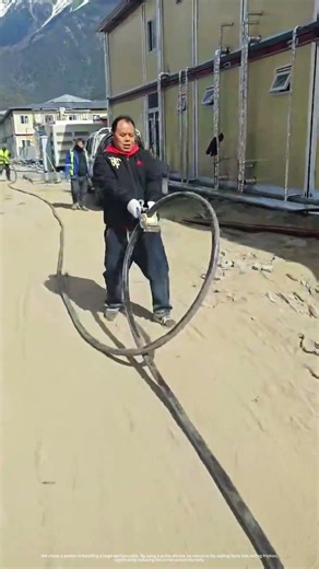 One person handles large cables: Labor-saving traction pulley