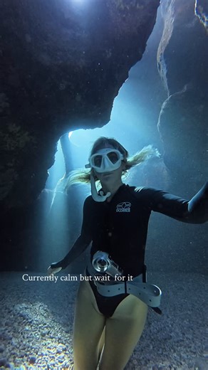 Michelle Edgehouse 🪸 Ocean, Travel, Freediving, Photography on Instagram: "If you’re a regular freediver you’ve probably done some questionably sketchy things especially as the seasons are changing at your local dive spots…One of these might be doing a swim through while there’s still the occasional big sets rolling through during your dive like I did here 😆.. what’s important if you happen to already be INSIDE the cave WHILE the set rolls in is to: 🧘🏼‍♀️stay calm, HOLD ON (trying to limit g