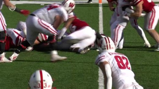 Graham Mertz plows into the end zone to give Wisconsin the lead