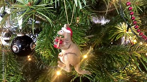 Closeup of australian kangaroo hanging from a decorated Christmas tree Stock Video