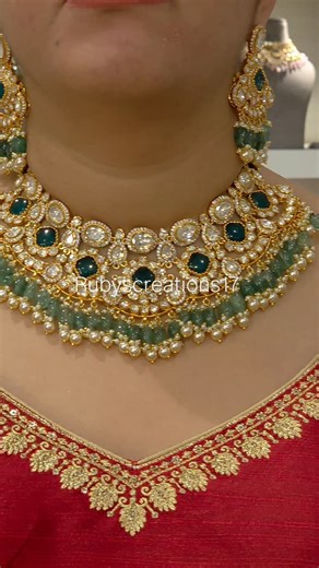 𝐑𝐮𝐛𝐲'𝐬 𝐂𝐫𝐞𝐚𝐭𝐢𝐨𝐧𝐬 on Instagram: "This Ayesha moissanite polki set is the epitome of elegance and sophistication. Crafted with mixed metal alloy and plated in 22 kt gold, this bridal and semi-bridal necklace set showcases lustrous top shade moissanite polki with emerald green doublets. Adorned with micro pearls and emerald green strawberry beads, it exudes luxury and charm for any special occasion. . 🔸️Buy online at www.rubyscreation.com .product name is Ayesha moissanite polki set.