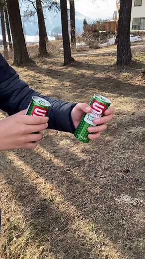 Opening Sprite Cans in a Scenic Outdoor View