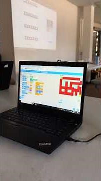 Student showing us how he created his Scratch game that integrates with AI!