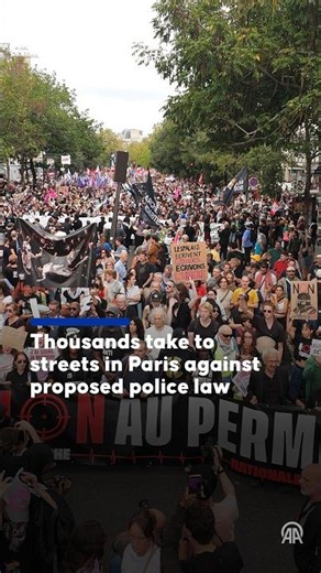 Thousands take to streets in Paris against proposed police law