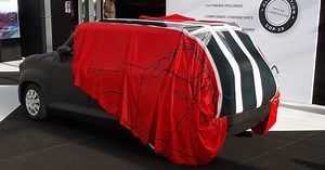 Watch this wild video of a retractable solar EV-charging car cover
