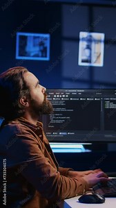 Software engineer doing programming using augmented reality visualization during remote job shift in home office. IT admin working on computer, looking at AR hologram, camera B