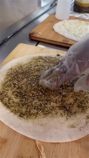 Thyme Machine Cafe 🚀 on Instagram‎: "Ziad Rahbani lived on man’oushe. Zaatar. Then jebneh. Then zaatar w jebneh. The cocktail. That’s Lebanon’s real street food. Not fancy. Not rare. For rich and poor. Morning, noon, night. Man’oushe is life. عالصاج. بإيدين الناس. That’s why Thyme Machine is open 24 7. We bring real Lebanese street food to the US. No filters. Just nostalgia. 🫓🇱🇧 #Manoushe #Zaatar #Jebneh #ThymeMachine #LebaneseStreetFood"‎