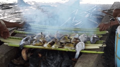 clip-3998531447-traditional-method-grilling-whole-fish-specifically ...