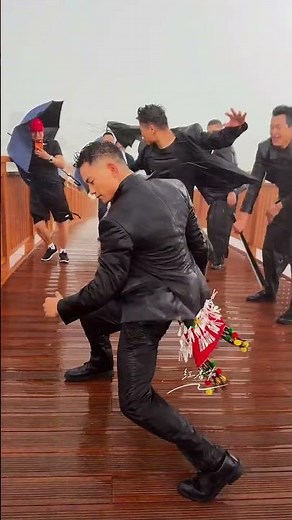 Yuan Zhiping dancing in the pouring rain