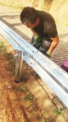 Installing Guardrails: Workers Secure New Highway Safety Barriers