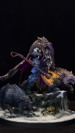 Dennis on Instagram: "🐺 Space Wolf Champion with Fenrisian Wolves 🐺 Victory is his mantle, the hunt his law. The Space Wolf Champion strides forward, two Fenrisian Wolves at his flanks, every step a testament to skill, courage, and the unyielding spirit of Fenris. As the prize of the painting competition, he stands not only as a warrior, but as a symbol: excellence forged in frost and fury. ❄️⚔️🛡️ Sieg ist sein Mantel, die Jagd sein Gesetz. Der Space Wolf Champion schreitet voran, zwei Fenris