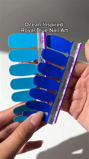 32K views · 330 reactions | HOT RN  Blue nails are taking over our feed and we’re not mad at it  “Lagoon” navy blue shimmer pairs perfectly with “Blue-dapest” sky blue neon to come together in this dreamy wave-inspired nail art  Save this mixed mani for your next nail look — no salon required ️ https://bit.ly/4kAGuqK #ColorStreet #BlueNails #NailArt #SummerNails #BrightNails #NailInspo #GlitterNails #BlueMani #KleinBlue #Royals | Color Street | Facebook