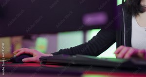 Keyboard, mouse and gamer woman hands in gaming neon room for futuristic workspace, video game and online cyber streaming. Gen z, cyberpunk streamer or software developer with games in dark office