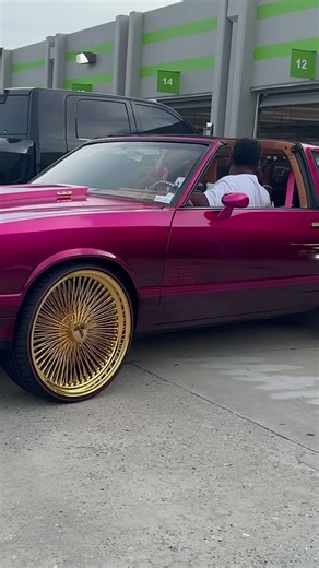 Candy Magenta Chevy MC and Oldsmobile Cutlass on Gold 24’s Daytons