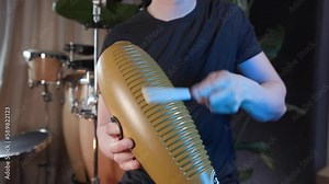 Traditional Guiro Latin percussion cuban musical instrument played by male musician drummer