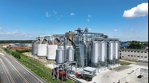 Agro-processing manufacturing plant for processing drying cleaning and storage of agricultural product, grain harvest. Modern silos. grain elevator facility. Large iron terminal of grain