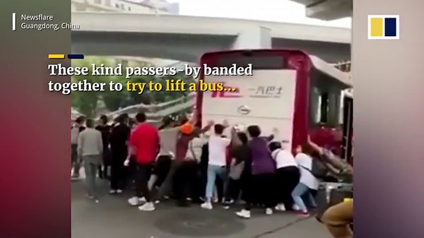 Passers-by lift bus together in attempt to rescue trapped man in China